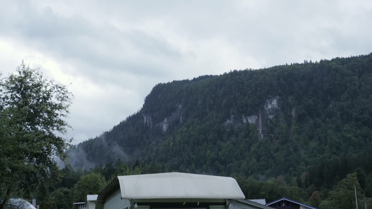 Timelapse of fog uncover mountain forest in camping