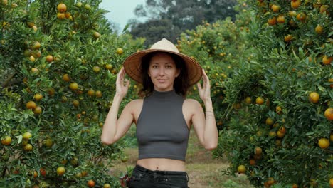 woman in an orange orchard