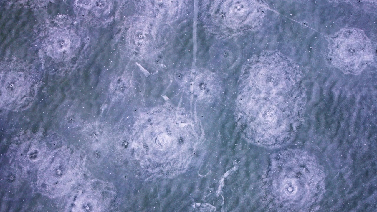 High-angle drone shot of frozen Great Lakes ice and winter textures