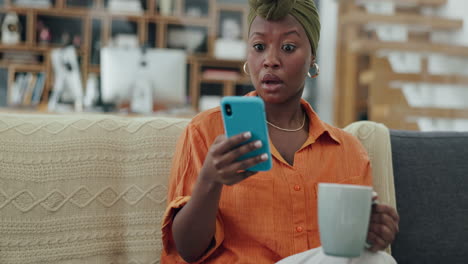 Phone,-coffee-and-shocked-black-woman-in-home