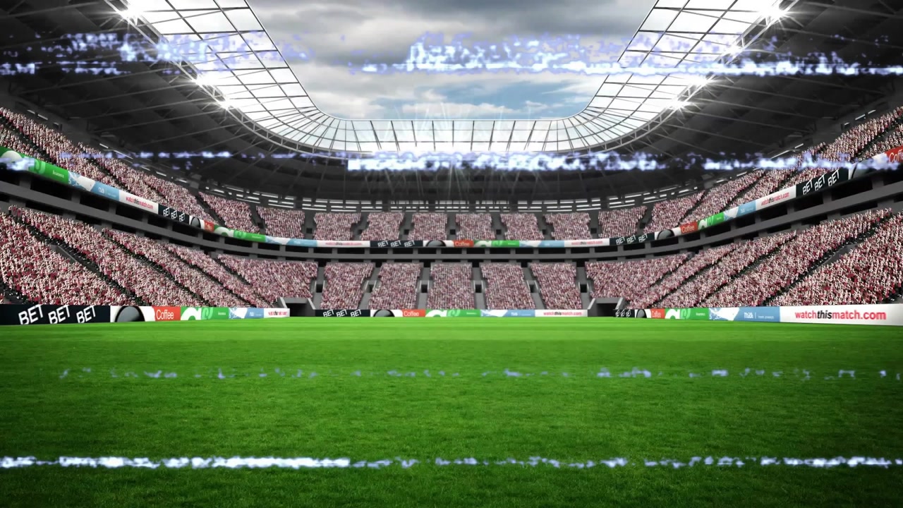 Glitch bands flickering across seating tiers and grass pitch after pause, showing broadcast glitch