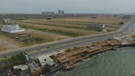 coastal highway and waterfront development: aerial view of a seaside city
