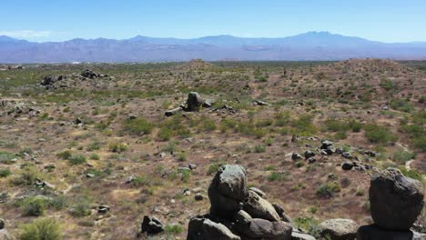 aerial fly over the mcdowell sonoran conservancy desert lands towards four peak, matazel mountains, scottsdale arizona