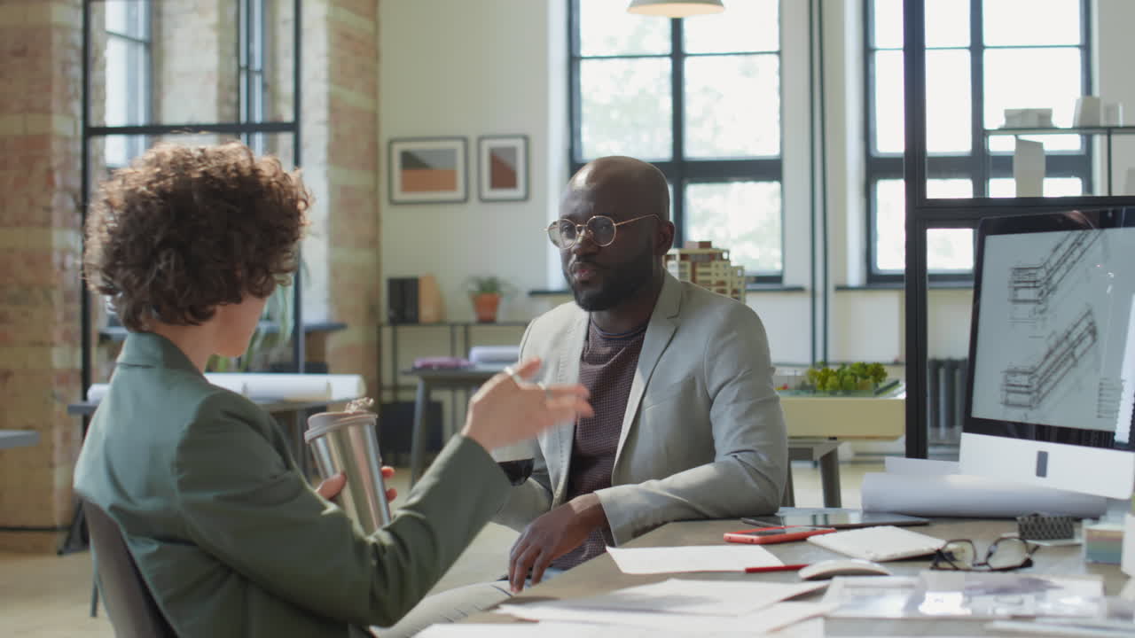 Architects discussing project plans in a modern office