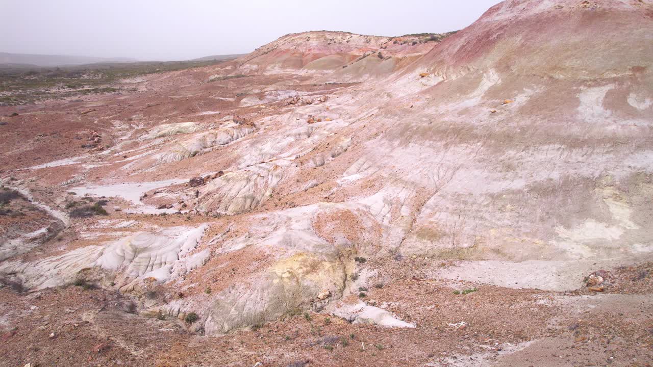 Rising Up drone shot revealing the ravines in the Red Canyon at Bahia Bustamante