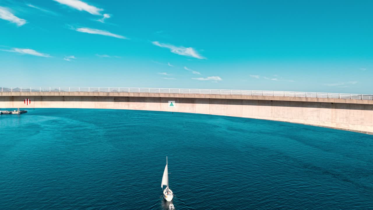 Bridge over Water with Sailboat
