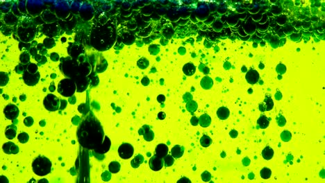 water oil bubbles  behind glass background