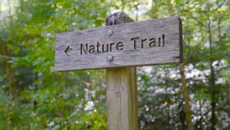 low angle sign showing direction of the nature trail close up