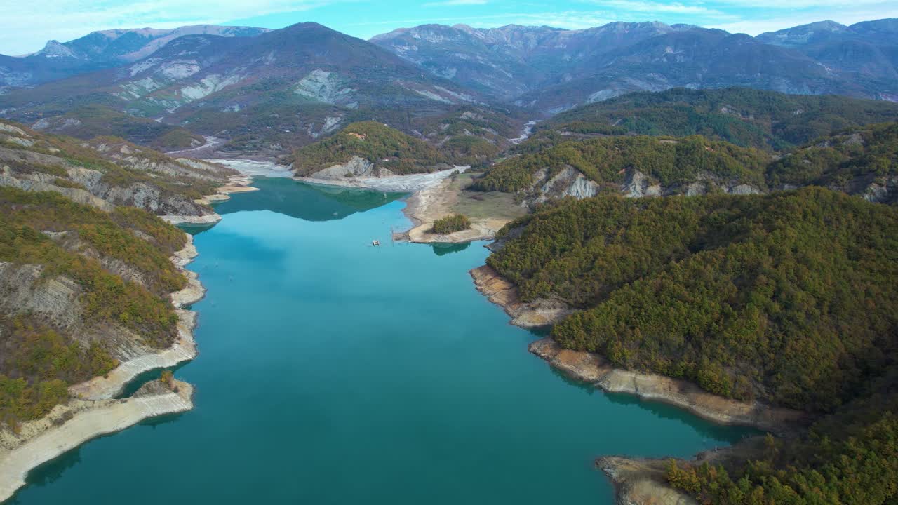 Drone View Over Serene Turquoise Waters of Bovilla Lake Surrounded by Lush Green Hills in Albania