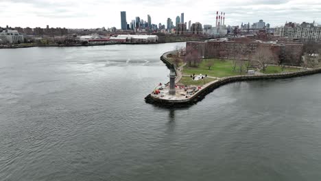 an aerial view of the roosevelt island lighthouse on a cloudy day