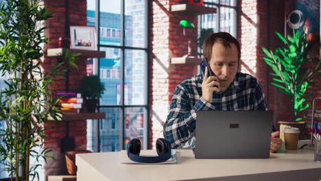 happy employee at home office desk organizing calendar appointments, doing videocall