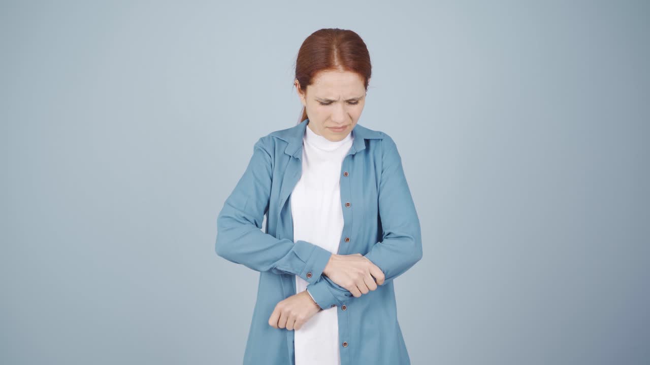 Woman experiencing pain in bones.