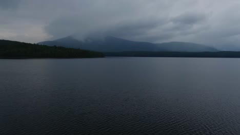 stunning time-lapse of a dark, atmospheric foggy rainy lake in the appalachian mountains