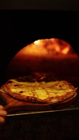 delicious pizza baking in a wood-fired oven