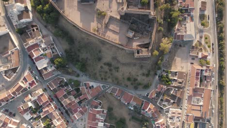 vertical aerial top down view revealing castro marim castle and surrounded parish village