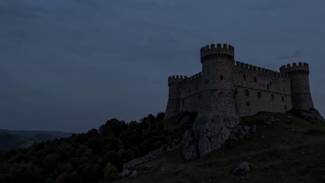 ancient castle on a hilltop at dusk