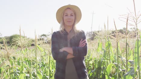 video of happy caucasian woman standing in field on sunny day