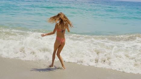 Caucasian-woman-having-fun-on-the-beach-4k