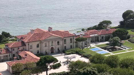 aerial view of pacific ocean front mansion in malibu