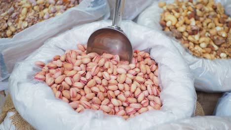 Pistachios-nut-in-a-container-for-sell-at-local-shot-in-turkey-,
