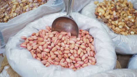 pistachios nut in a container for sell at local shot in turkey ,