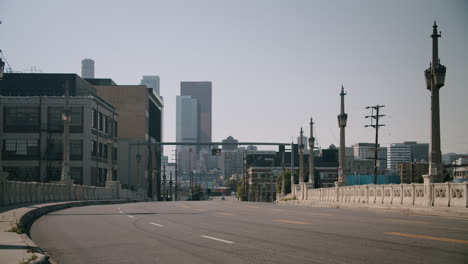 empty urban bridge leading to city skyline