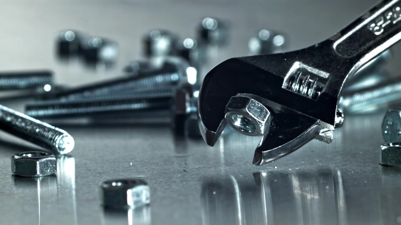 Adjustable Wrench Tightening and Loosening a Nut on a Bolt