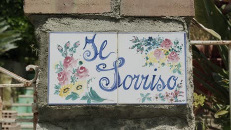 close up shot of a beautiful handmade sign on the roads of capri, in italy - 02