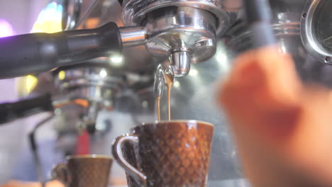 coffee maker pours coffee into vintage cup-1