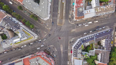 Rush-Hour-in-City-Center,-Daylight-Aerial-Hyper-Lapse,-Motion-Time-Lapse-above-Berlin-Rosenthaler-Platz-in-Busy-City-Car-Traffic-and-public-transport