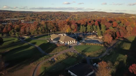 Descending-towards-majestic-luxury-mansion-surrounded-by-forestry-land