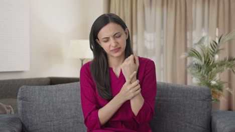 Sick-Indian-woman-suffering-from-hand-pain