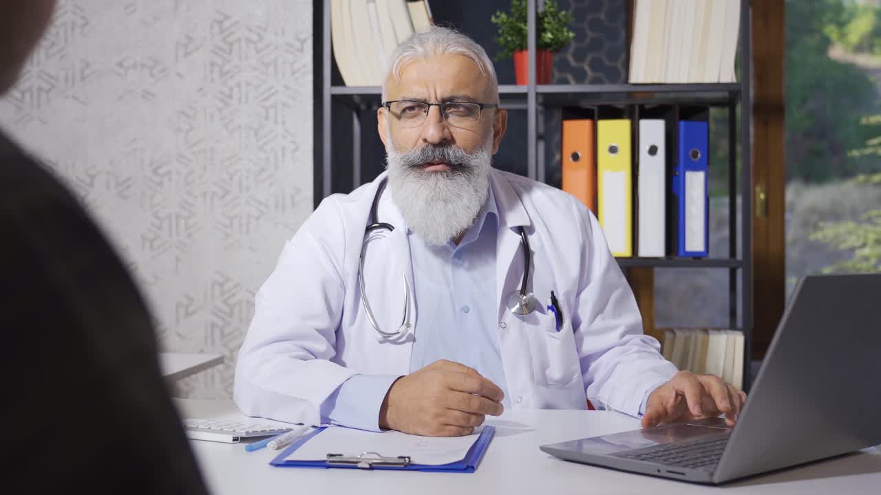 Senior family doctor informing his patient.