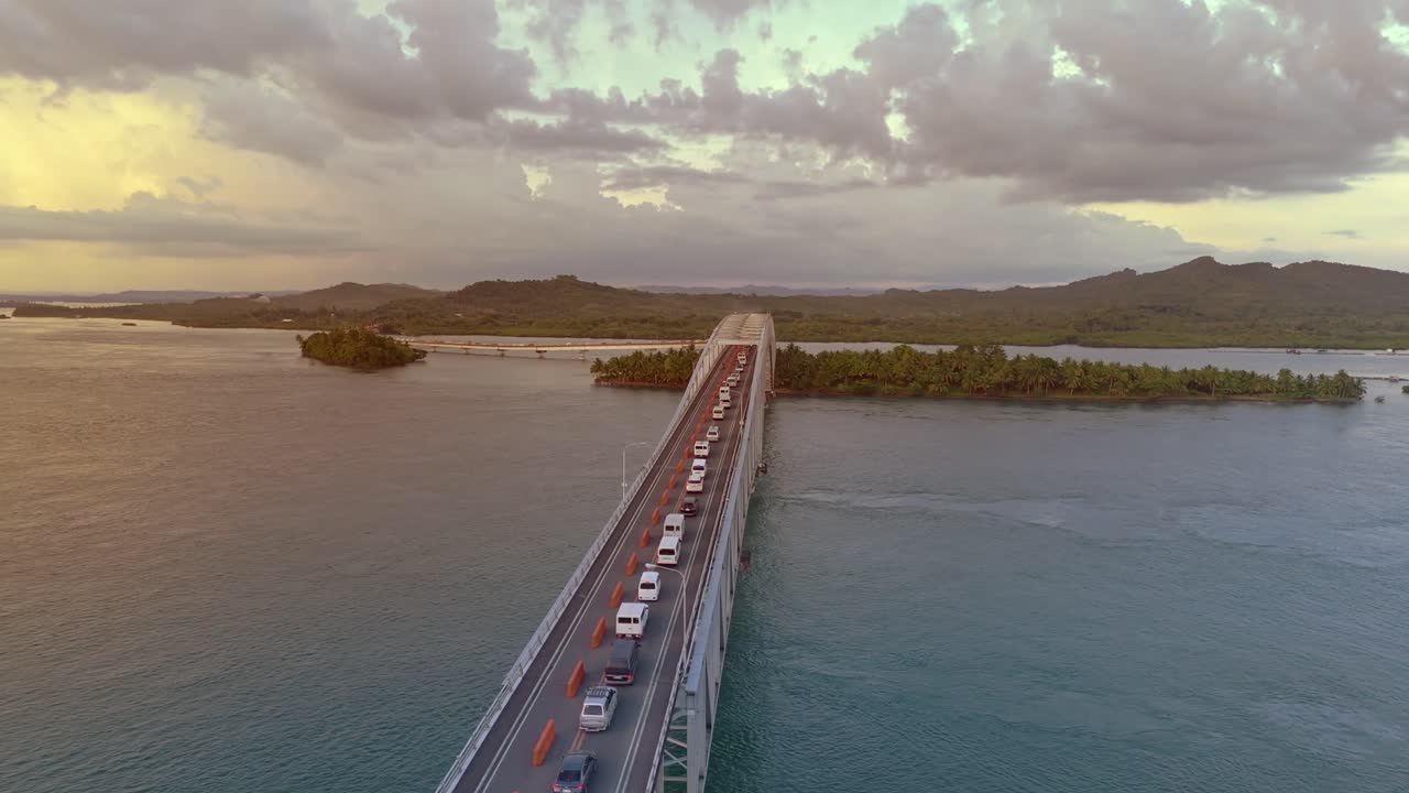 Golden hour over the San Juanico Bridge with gridlocked one way traffic