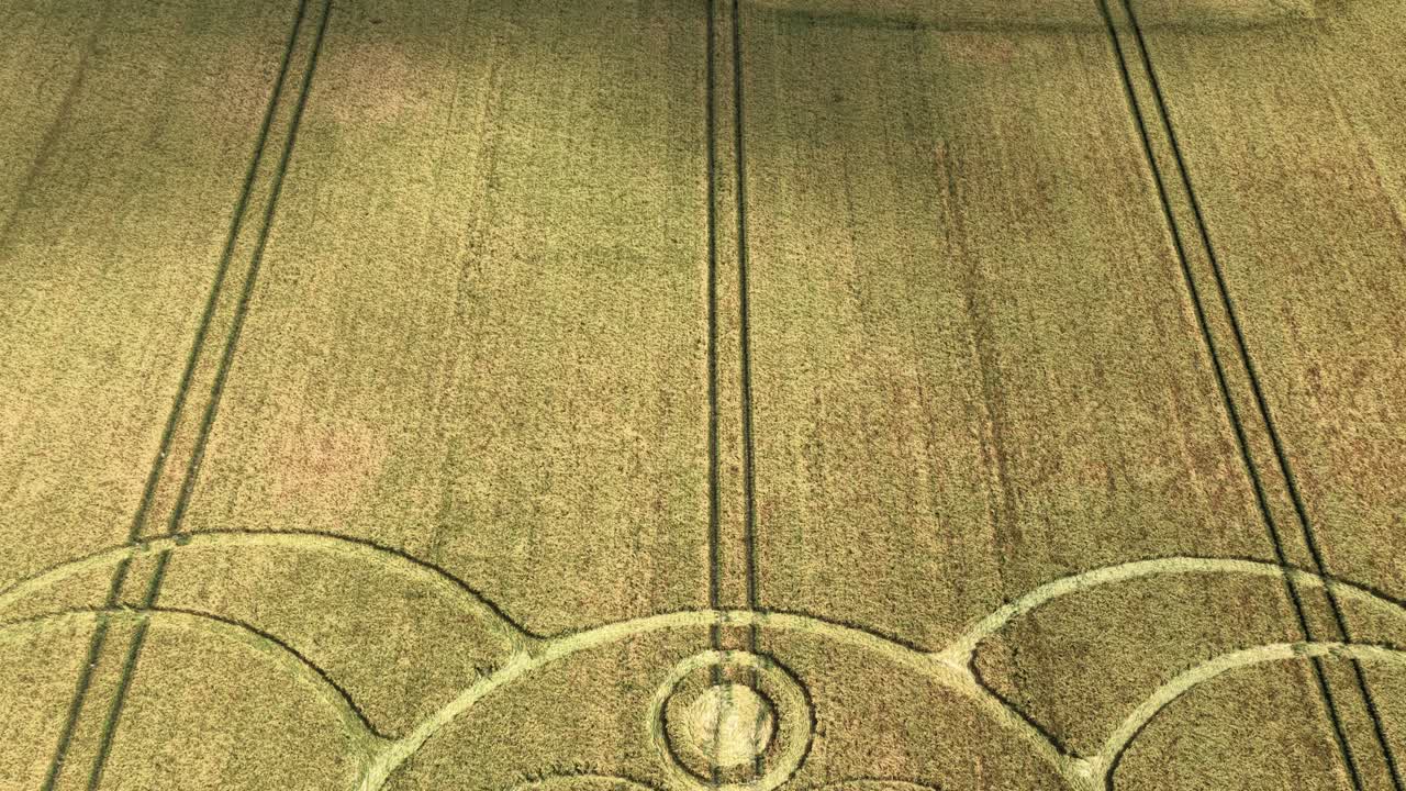 Idyllic Stonehenge countryside aerial view looking down to reveal jester crop circle farmland