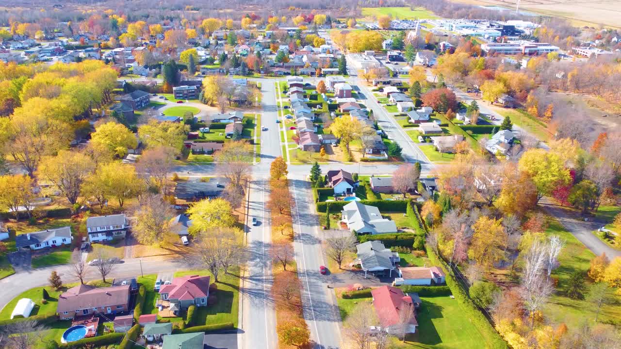 Beautiful town with cozy estates and vibrant autumn colors in Canada, aerial view