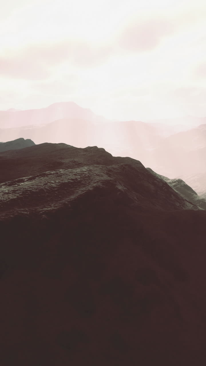 Majestic mountains illuminated by soft sunlight during serene morning hours