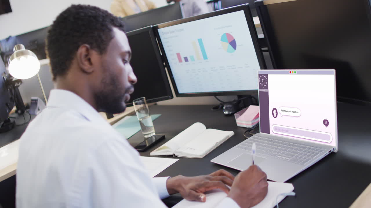 Composition of african american businessman using laptop with ai chat on screen