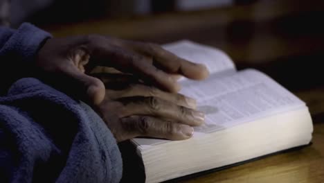 praying-to-God-with-bible-faithfully-worshipping-with-people-stock-footage-stock-video