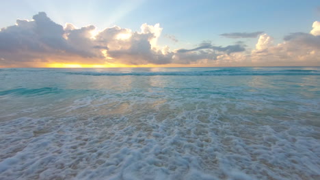 slow motion sunrise on the ocean with crashing waves