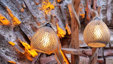 rustic woven lamps on brick wall