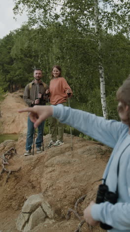 family on a hike with binoculars