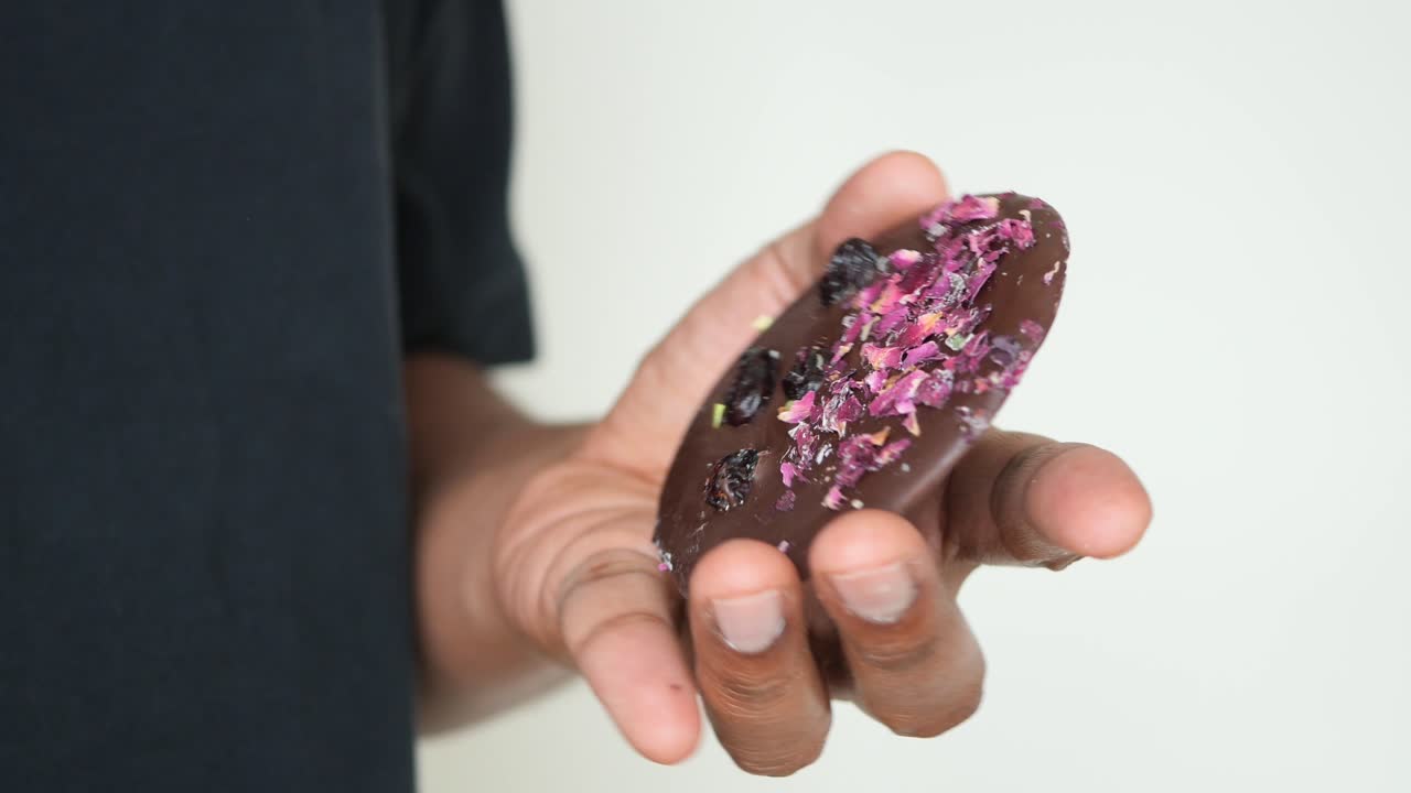 Chocolate dessert with rose petals and raisins