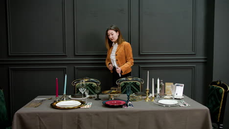 Asian woman organizing ornaments on a table
