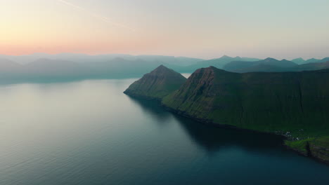 Panoramic Coastal Landscape with Green Mountains and Sea at Dusk
