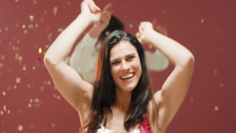woman blowing glitter and man dancing
