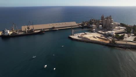 aerial shot in orbit over the arguineguin cement factory on the island of gran canaria