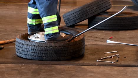 two-men-changing-a-tire-on-a-rim