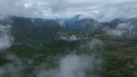 clouds drifting over green mountains near cetinje, montenegro, with moody atmosphere