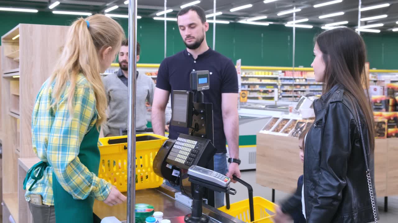 Family Checking Out at Grocery Store